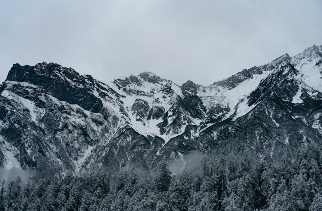 snow covered mountain during daytime